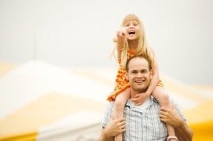 Child on Father's shoulder