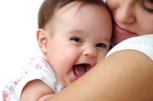 Laughing baby and mother