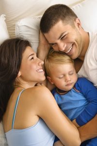 Parents and sleeping baby