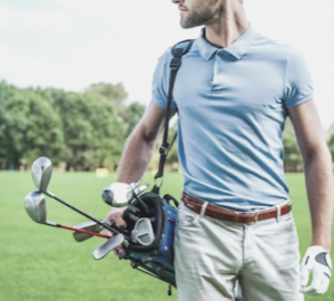 Pain and discomfort in golf, male golfer carrying bag